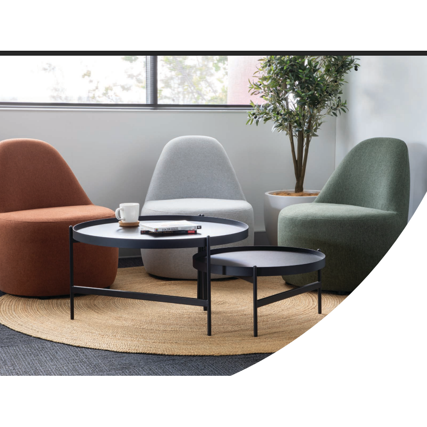 Modern living room with three armchairs and a coffee table.