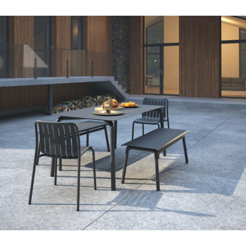 Outdoor furniture set with table and chairs on a patio