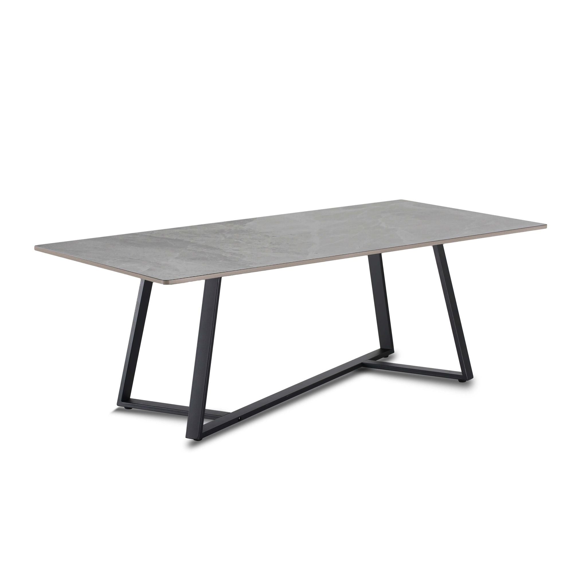 Rectangular table with a gray surface and black metal legs on a white background