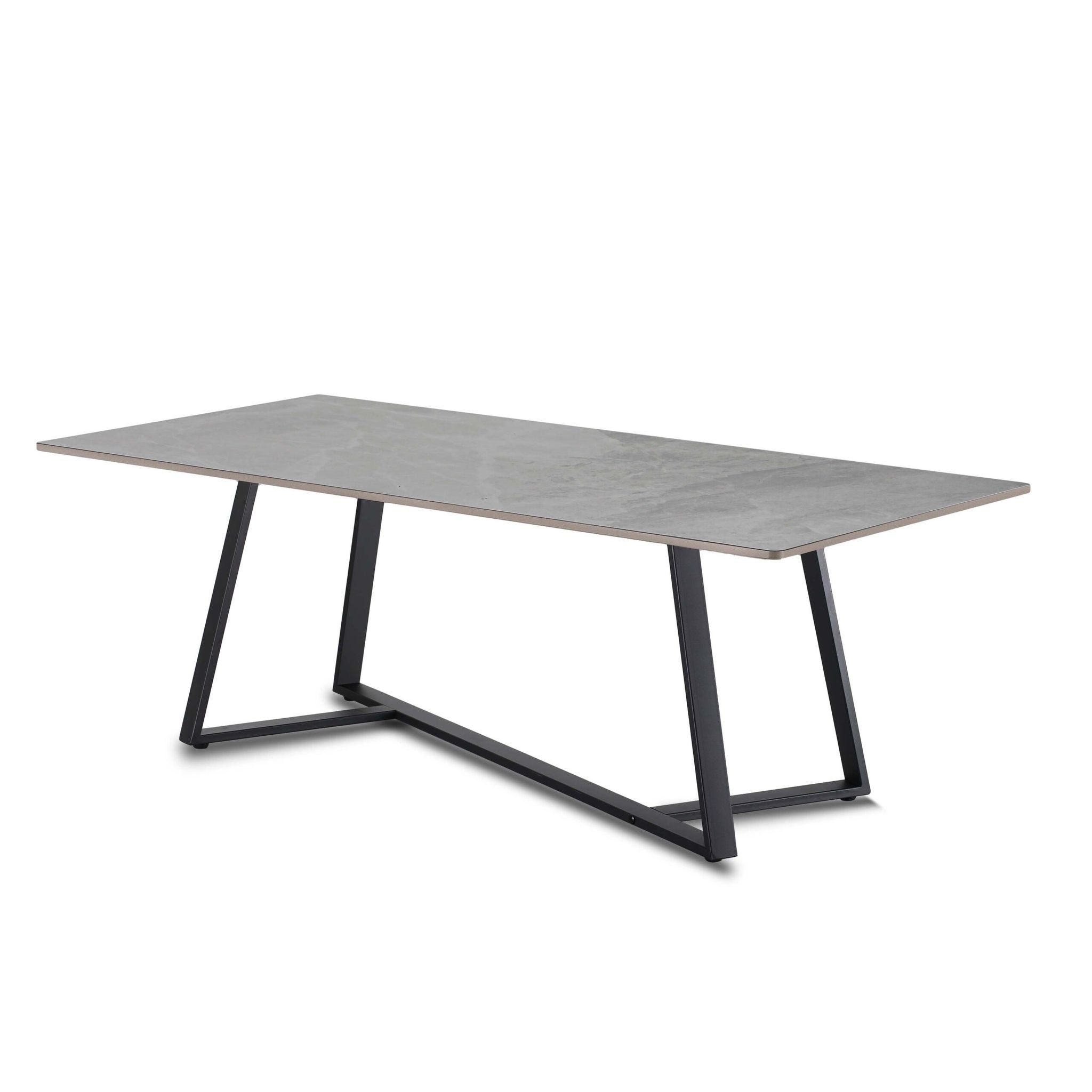 Rectangular table with a gray concrete top and black metal legs on a white background